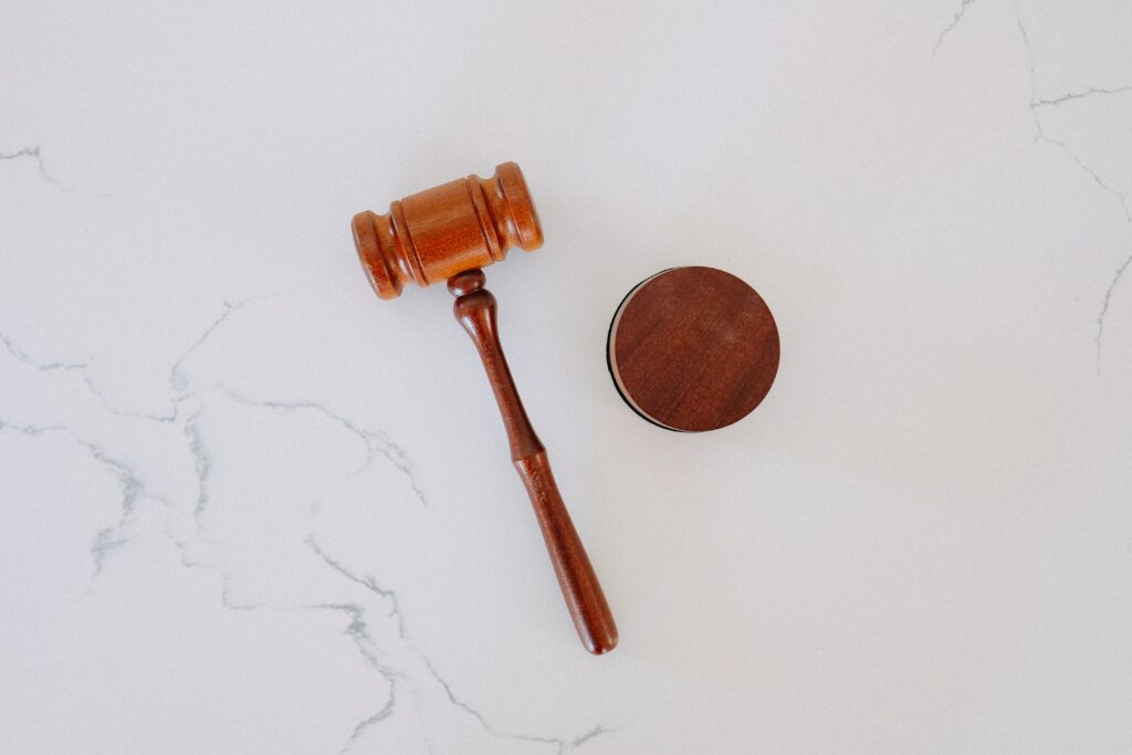 brown gavel on white marble surface 